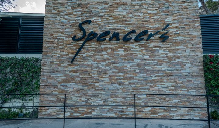 Brick facade with the name "Spencer's" in stylized black letters.
