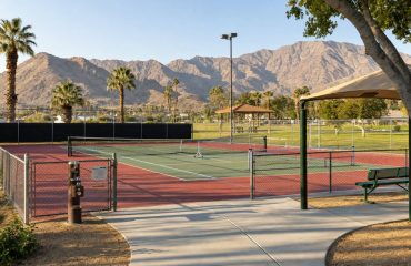 Combined tennis and pickleball park court striped for both sports