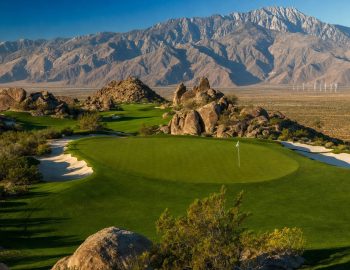 Cimarron Golf Resort Boulder Course green framed by granite boulders with the San Jacinto Mountains behind, Cathedral City